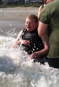 Helping Lynn "swim" in the ocean.