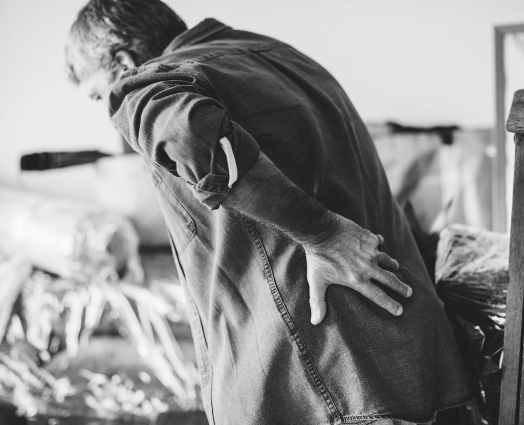 Caregivers are at high risk for back injuries due to using improper body mechanics when moving family members.