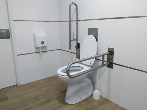 Bathroom fixtures adapted for use by someone with mobility limitations help make the room accessible.